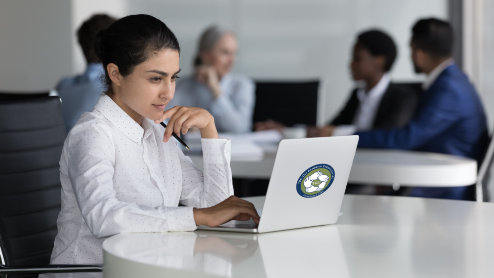 Woman at computer learning about herself and her team